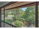 Lush backyard view, showcasing mature trees, and a serene golf course setting at 6040 Oak Creek Ln # 1822, Bradenton, FL 34210