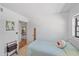 A serene bedroom with a cozy wicker bed, offering a peaceful retreat within the home at 6040 Oak Creek Ln # 1822, Bradenton, FL 34210