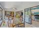 Cozy screened-in lanai offering a comfortable space to relax, dine, and enjoy the peaceful surroundings and access to the kitchen at 6040 Oak Creek Ln # 1822, Bradenton, FL 34210