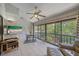 Bright and airy lanai with a relaxing lounge area, and serene views of the surrounding golf course and mature trees at 6040 Oak Creek Ln # 1822, Bradenton, FL 34210