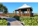 Beachside pavilion featuring sturdy wooden structure and path, offering a relaxing spot with ocean views at 6204 Midnight Pass Rd # 102, Sarasota, FL 34242