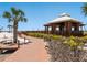 Beachside pavilion featuring sturdy wooden structure and path, offering a relaxing spot with ocean views at 6204 Midnight Pass Rd # 102, Sarasota, FL 34242