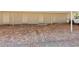Paved covered parking area with storage units and ample space at 6204 Midnight Pass Rd # 102, Sarasota, FL 34242