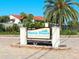 Siesta Dunes community sign amidst lush landscaping and palm trees at 6204 Midnight Pass Rd # 102, Sarasota, FL 34242