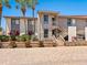 Well-maintained condo complex featuring lush landscaping, a private entrance, and brick paver path at 6204 Midnight Pass Rd # 102, Sarasota, FL 34242