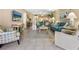 Inviting living room with tile flooring, comfortable seating, and stylish decor for a relaxing atmosphere at 6204 Midnight Pass Rd # 102, Sarasota, FL 34242