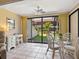 Inviting dining area with sliding doors, offering scenic views of the private patio at 6204 Midnight Pass Rd # 102, Sarasota, FL 34242