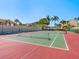Community tennis courts surrounded by lush greenery for active recreation and enjoyment at 6204 Midnight Pass Rd # 102, Sarasota, FL 34242