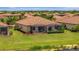 Beautiful home with a screened-in patio overlooking a tranquil pond at 6642 Willowshire Way, Bradenton, FL 34212