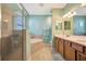 Spa-like bathroom with walk-in shower, soaking tub, double vanity, and neutral tones creating a relaxing retreat at 6642 Willowshire Way, Bradenton, FL 34212