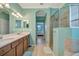 Spa-like bathroom with walk-in shower, soaking tub, double vanity, and neutral tones creating a relaxing retreat at 6642 Willowshire Way, Bradenton, FL 34212
