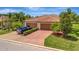 Charming two-car garage home with a well-manicured lawn and beautiful landscaping at 6642 Willowshire Way, Bradenton, FL 34212