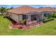 Charming home with a screened in patio and meticulously landscaped yard in a serene setting at 6642 Willowshire Way, Bradenton, FL 34212