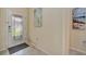 Foyer featuring tile flooring, a decorative glass door and neutral paint at 6642 Willowshire Way, Bradenton, FL 34212