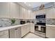 Lovely kitchen with stainless steel appliances, custom cabinets, and a bright design, great for cooking and entertaining at 6642 Willowshire Way, Bradenton, FL 34212