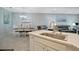 Open concept living featuring an eat-in kitchen island flowing into the formal dining and sitting area at 6642 Willowshire Way, Bradenton, FL 34212