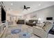 Inviting living room with a stylish rug, ceiling fan, and lots of room for entertaining at 6642 Willowshire Way, Bradenton, FL 34212