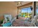 Relaxing screened-in patio with comfortable seating and tranquil lake views at 6642 Willowshire Way, Bradenton, FL 34212