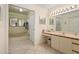 Relaxing bathroom with tub, walk-in shower, white cabinets and countertops at 6780 Schooner Bay Cir # 6780, Sarasota, FL 34231