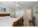 Bright bedroom features a ceiling fan, cool toned walls, and closet with sliding doors at 6780 Schooner Bay Cir # 6780, Sarasota, FL 34231