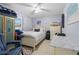 Cozy bedroom with neutral walls, tile floors, and closet space at 6780 Schooner Bay Cir # 6780, Sarasota, FL 34231