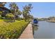Private dock with boat lift on a canal, offering direct access to the water and scenic views at 6780 Schooner Bay Cir # 6780, Sarasota, FL 34231