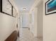 Bright foyer with tiled floors, a white front door, and elegant decor, creating a welcoming entrance at 6780 Schooner Bay Cir # 6780, Sarasota, FL 34231