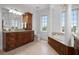 Spacious bathroom with tub, walk-in shower, and large vanity with storage at 6802 68Th E Ave, Bradenton, FL 34203