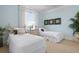 Charming bedroom features two twin beds, soft colors, and ample natural light at 6802 68Th E Ave, Bradenton, FL 34203