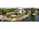 Stunning, three-story waterfront home featuring a private pool, lush landscaping and a dock with boat lift at 6802 68Th E Ave, Bradenton, FL 34203
