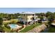 Beautiful yellow waterfront home with a private pool, lush landscaping and balconies with incredible views at 6802 68Th E Ave, Bradenton, FL 34203