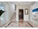 Grand foyer featuring tile floors, staircase and elevator at 6802 68Th E Ave, Bradenton, FL 34203