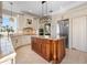 Well-equipped kitchen showcasing a central island, custom cabinets, and stainless steel appliances at 6802 68Th E Ave, Bradenton, FL 34203
