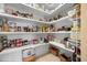 Walk-in pantry with lots of shelving perfect for storage at 6802 68Th E Ave, Bradenton, FL 34203