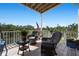 Covered porch featuring wicker furniture and water views at 6802 68Th E Ave, Bradenton, FL 34203