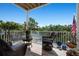Covered porch featuring wicker furniture and water views at 6802 68Th E Ave, Bradenton, FL 34203