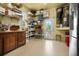 Organized storage room features shelves, cabinets, and a walk-out door at 6802 68Th E Ave, Bradenton, FL 34203