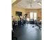 Gym or fitness center with several machines, a TV and natural light from windows at 7411 Vista Way # 102, Bradenton, FL 34202