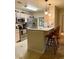 Kitchen with stainless steel appliances, raised breakfast bar, and hanging pendant lights at 7411 Vista Way # 102, Bradenton, FL 34202