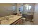 Clean bathroom featuring a granite-topped vanity and a glass-enclosed shower at 7858 Eagle Creek Dr # 7442, Sarasota, FL 34243