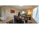 View of living room with a dining table, rug, and nearby open space at 7858 Eagle Creek Dr # 7442, Sarasota, FL 34243