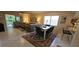 Cozy living and dining area with tile floors and comfortable seating at 7858 Eagle Creek Dr # 7442, Sarasota, FL 34243