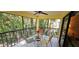 Relaxing screened patio with comfortable seating and lush green views at 7858 Eagle Creek Dr # 7442, Sarasota, FL 34243
