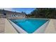 Community pool featuring a crystal-clear swimming pool and a spacious deck for lounging and recreation at 7858 Eagle Creek Dr # 7442, Sarasota, FL 34243