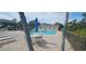 Community pool with lounge chairs, umbrellas, and tables offering a refreshing and relaxing space at 7858 Eagle Creek Dr # 7442, Sarasota, FL 34243
