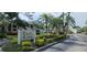 Eagle Creek community entrance sign surrounded by lush tropical landscaping, showing beauty of neighborhood at 7858 Eagle Creek Dr # 7442, Sarasota, FL 34243