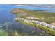 Gorgeous aerial view of waterfront community with lush landscaping and bay views at 79 Tidy Island Blvd, Bradenton, FL 34210