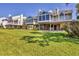 Backyard with lush green lawn and waterfront views at 79 Tidy Island Blvd, Bradenton, FL 34210