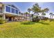 Expansive backyard with waterfront access and covered patio at 79 Tidy Island Blvd, Bradenton, FL 34210
