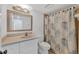 Bathroom featuring a shower with a patterned curtain, vanity, and toilet at 79 Tidy Island Blvd, Bradenton, FL 34210